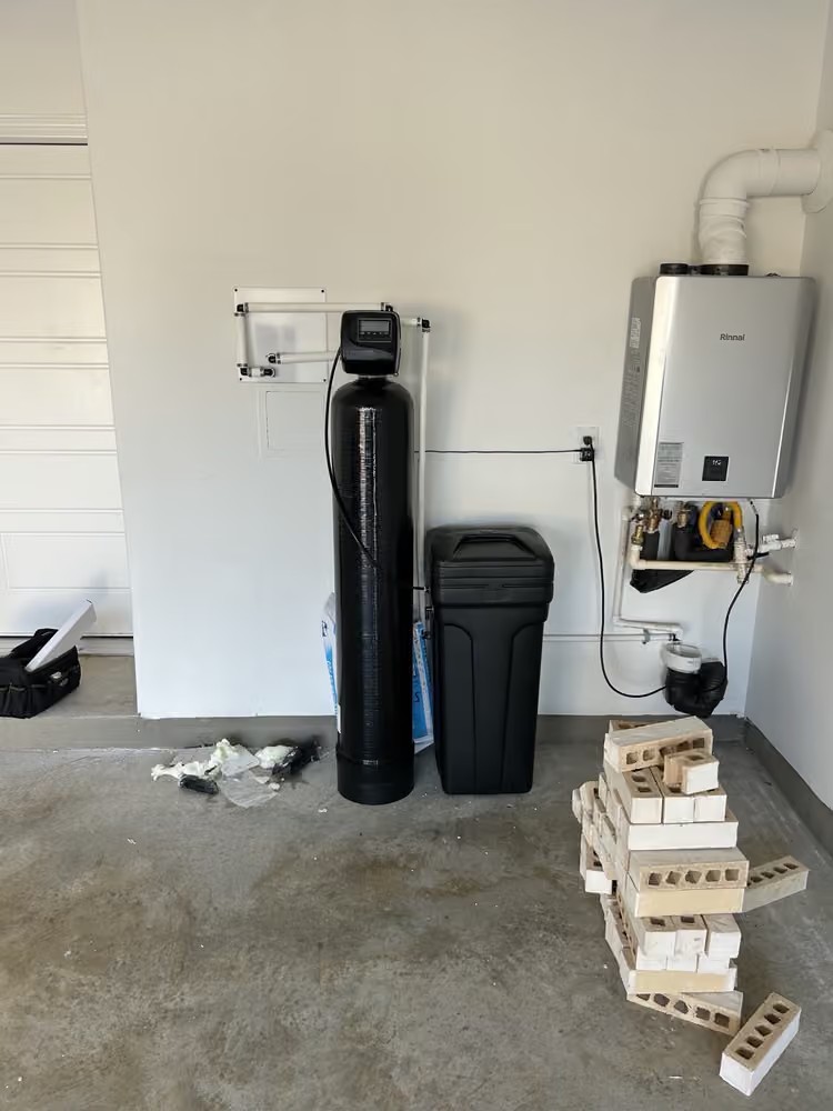 Aquanova whole-home softener installed next to tankless water heater