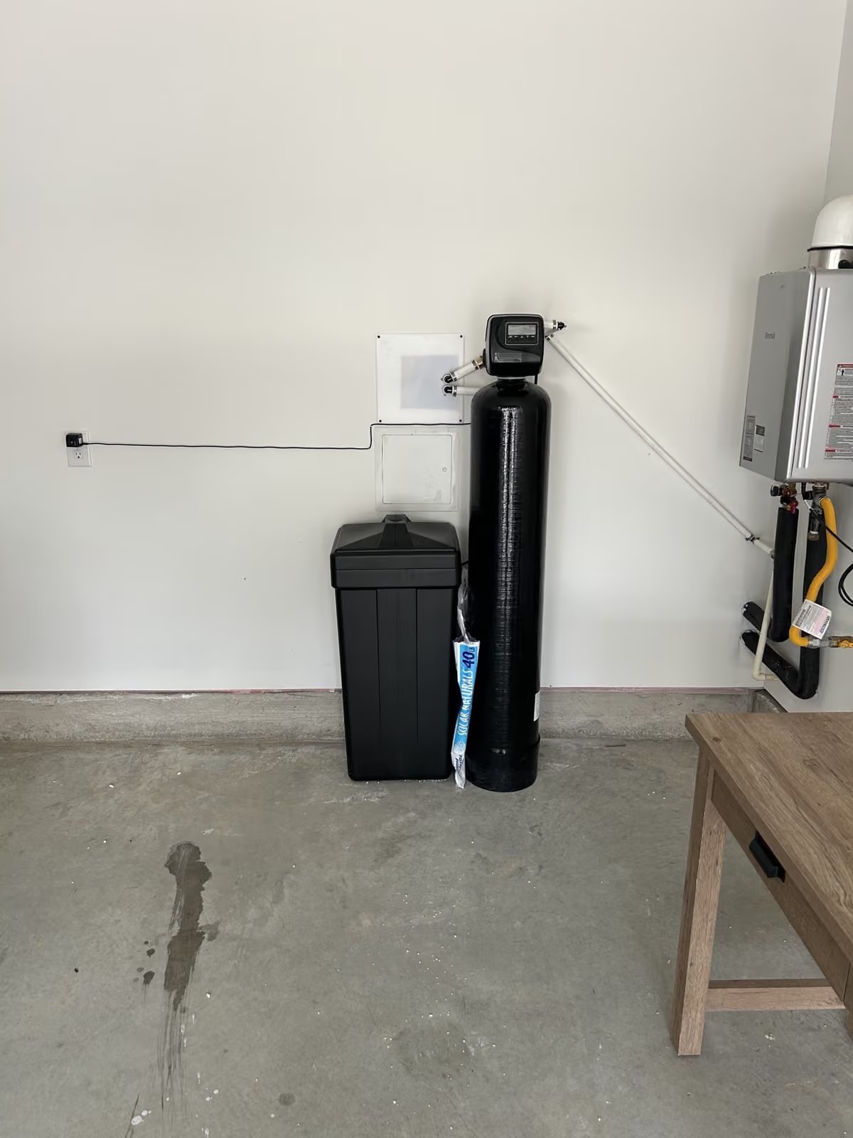 Aquanova water softener installation in home garage