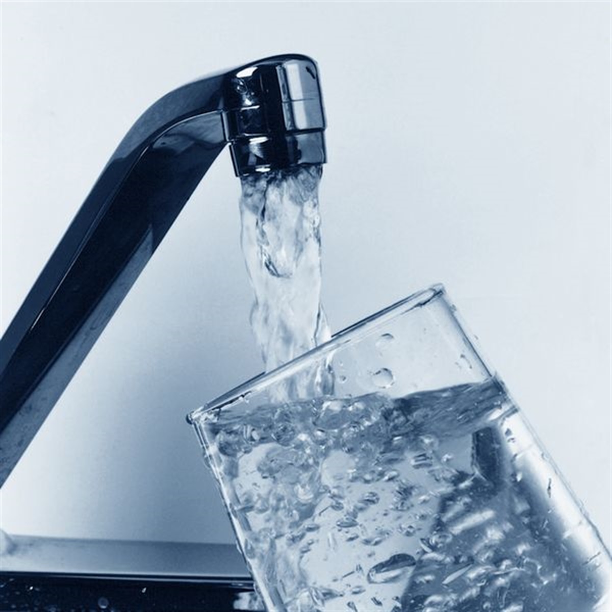 Clean water pouring into a glass